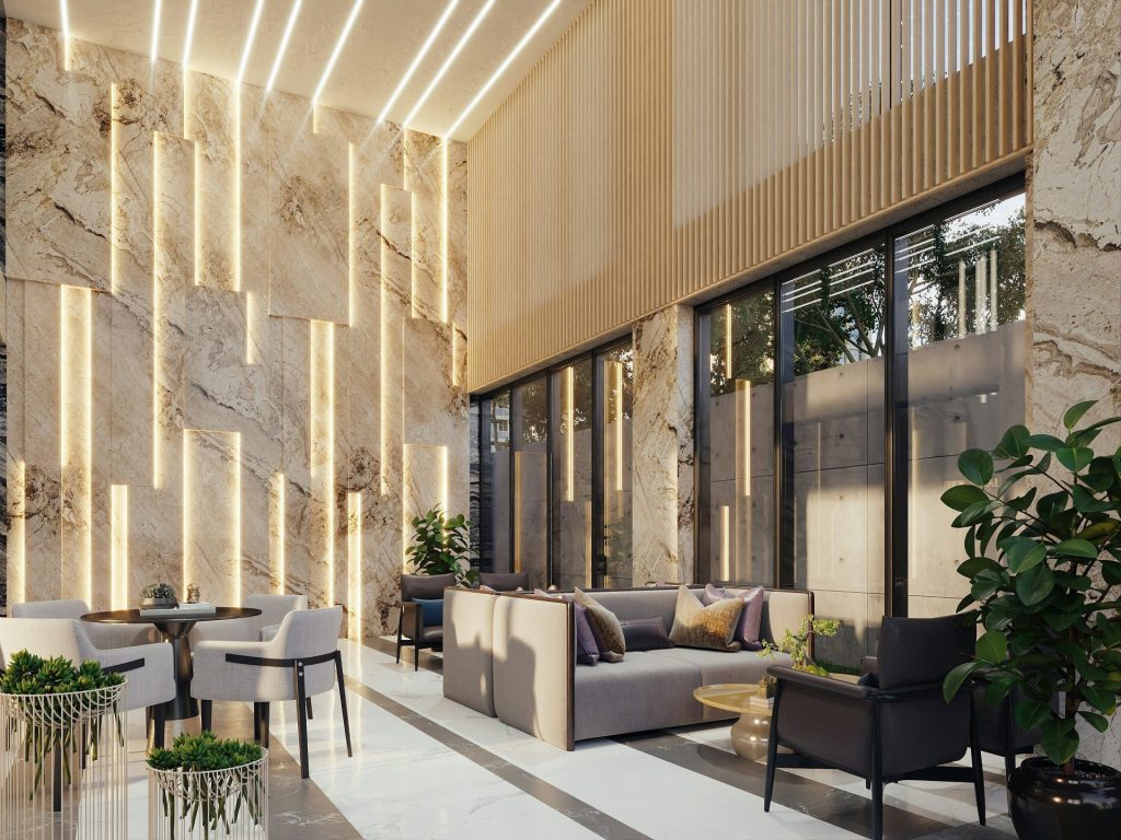 Modern lounge area with marble walls and ambient lighting.